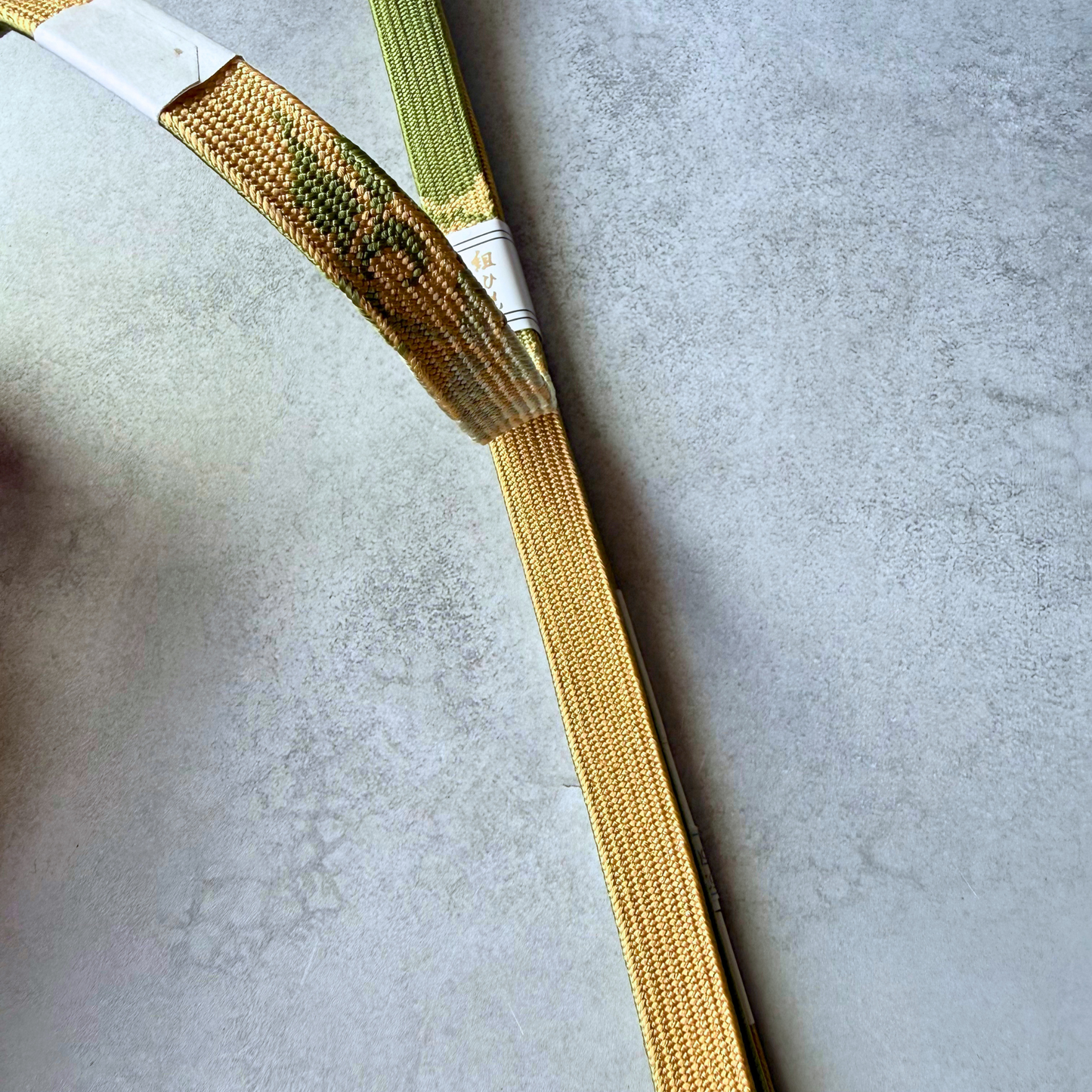 Gold and olive green silk kumihimo obijime braiding detail