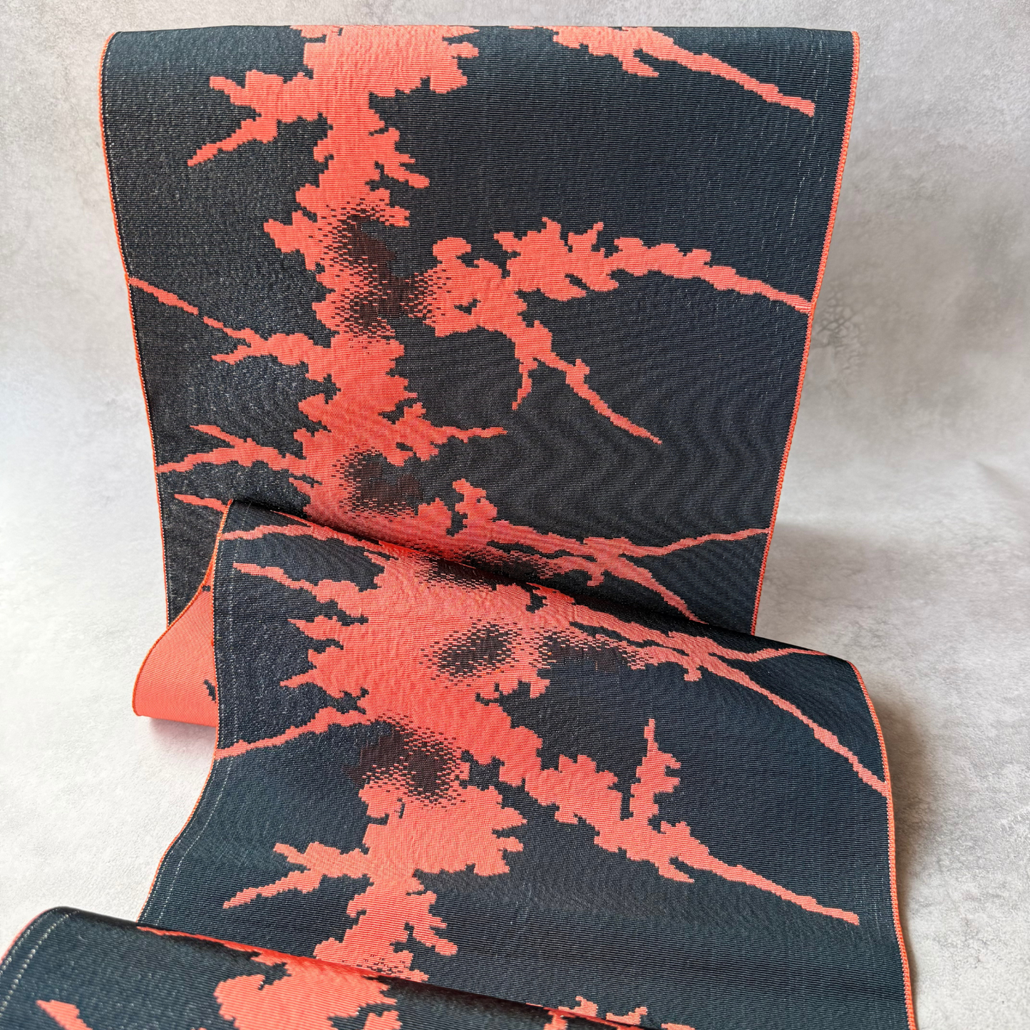 Black-dominant side of coral abstract Japanese hachisun obi fabric