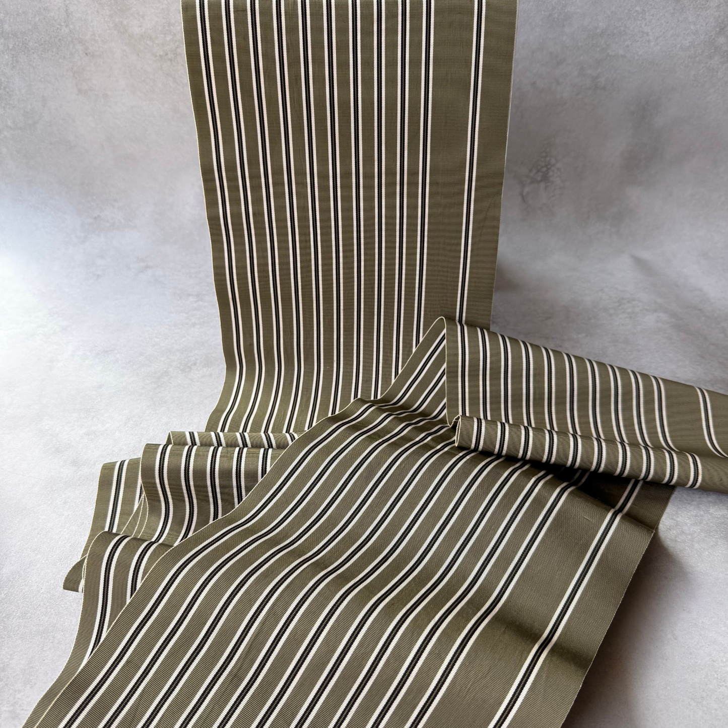 Japanese olive striped obi textile draped to show pattern and texture