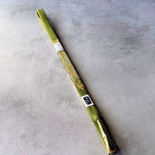 Unused Japanese silk Korai-gumi obijime cord in olive green and gold, full view