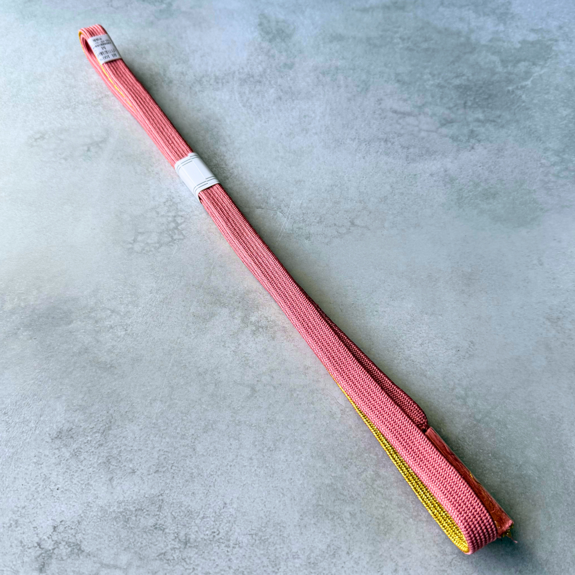 Plain dusty rose pink side of hand-braided Japanese silk obijime