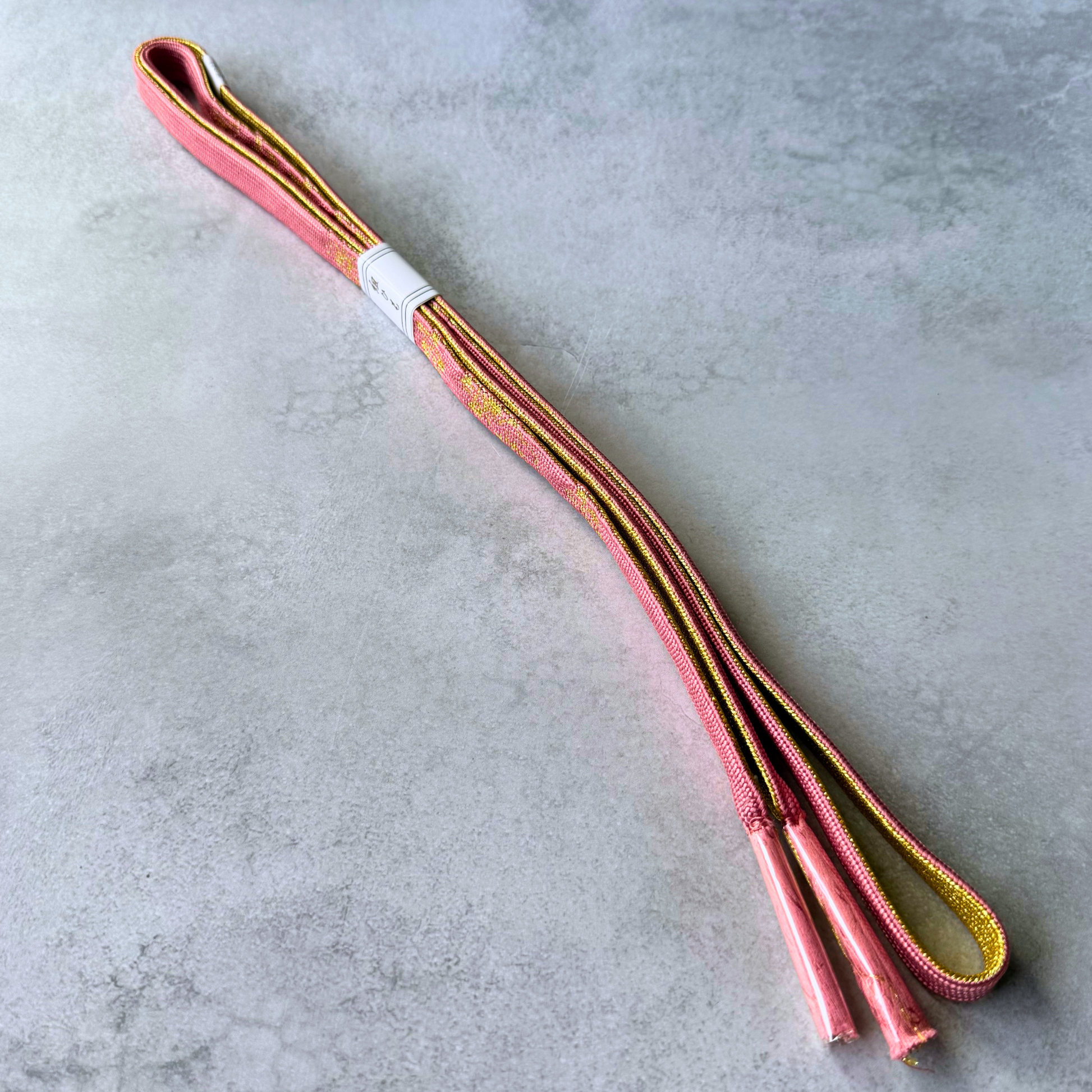 Front and reverse sides of dusty rose and gold silk obijime with matching tassels