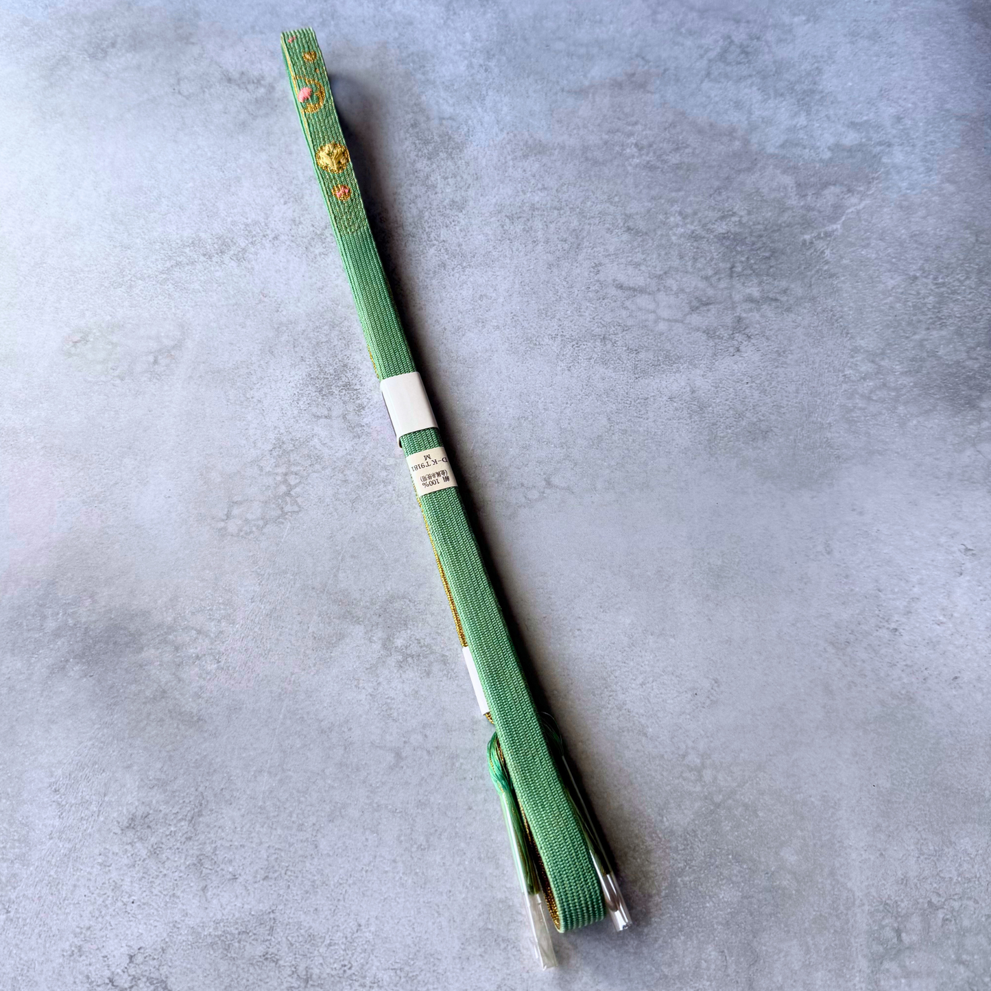 Reverse full view of celadon green Japanese silk hand-braided obijime cord