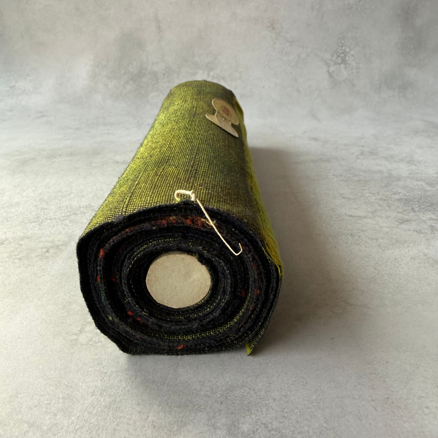 Rolled end of Japanese handwoven silk obi fabric bolt
