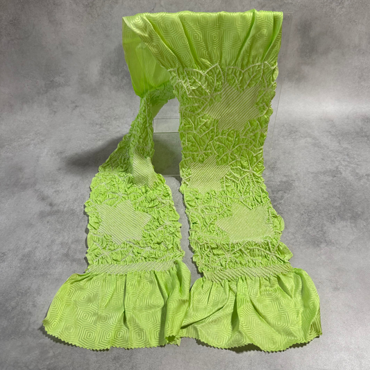 Full view of vintage Japanese vivid lime green silk shibori obiage with geometric panels