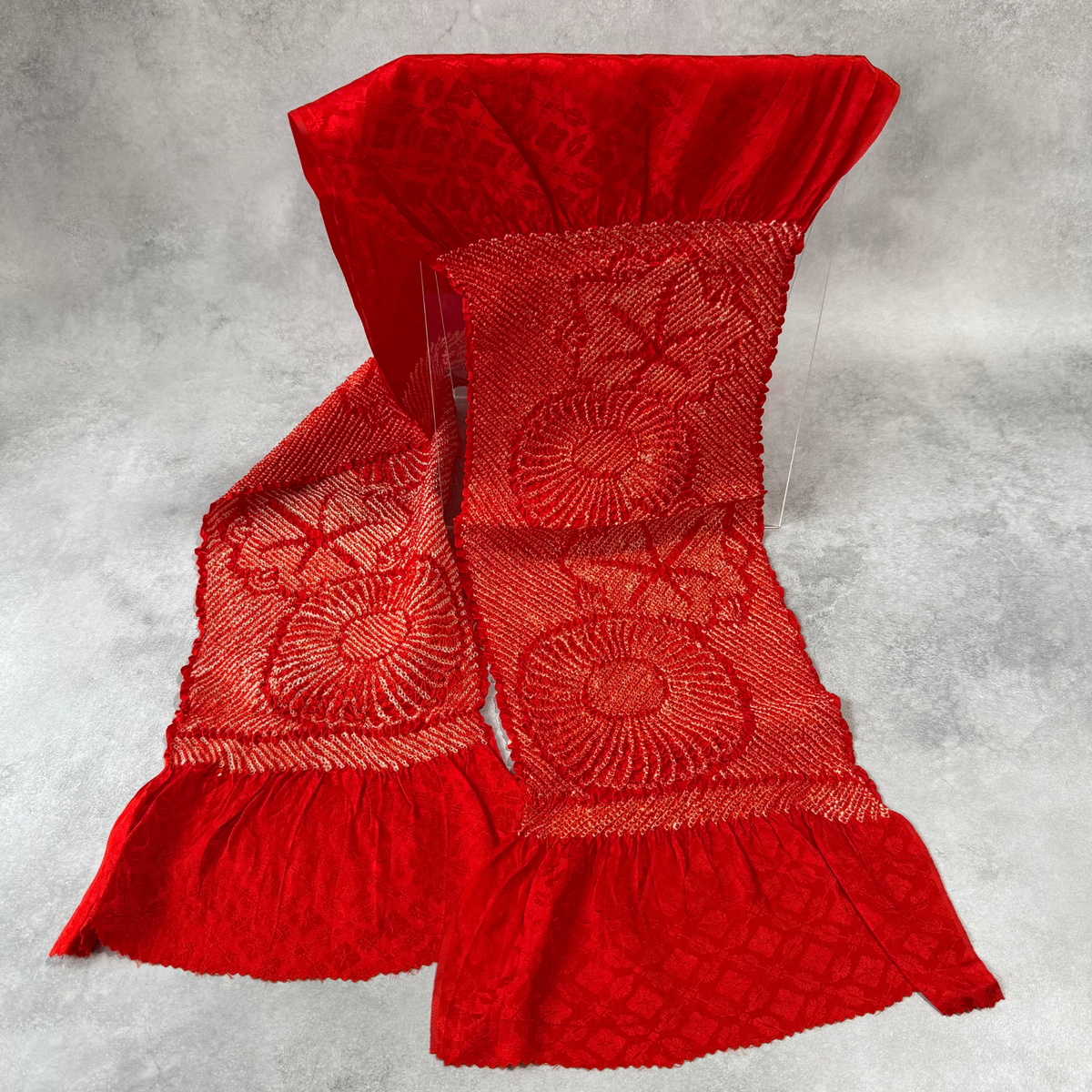Full view of vintage Japanese red silk shibori obiage with large floral motifs